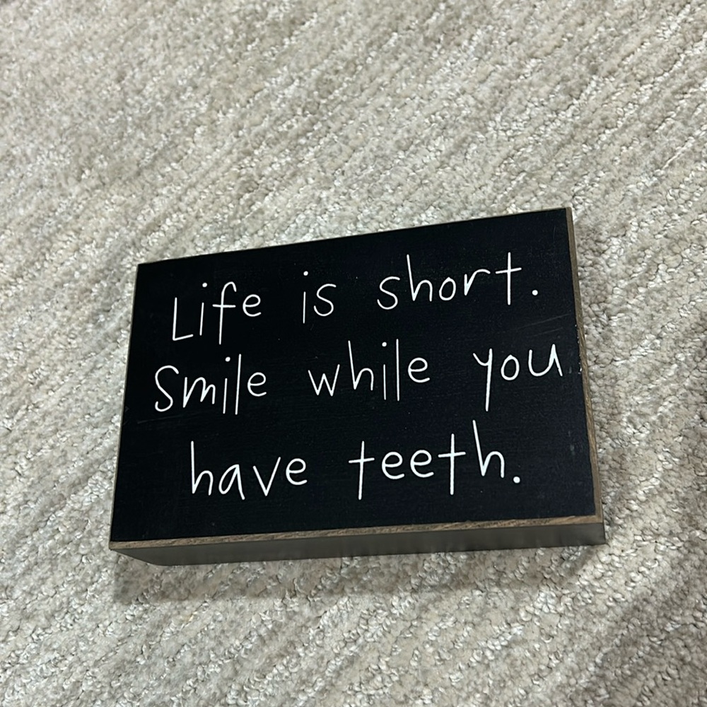 Life is short. Smiles while you have teeth.  Box Sign
